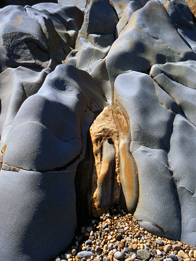 In a few places, pale brown Ordovician carbonate sits directly against the quartzite