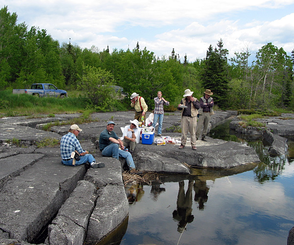 geologists Geological field party eating lunch on the shore of Cormorant Lake (June, 2006)
