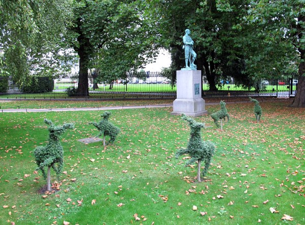 Outside the museum, topiary creatures caper.