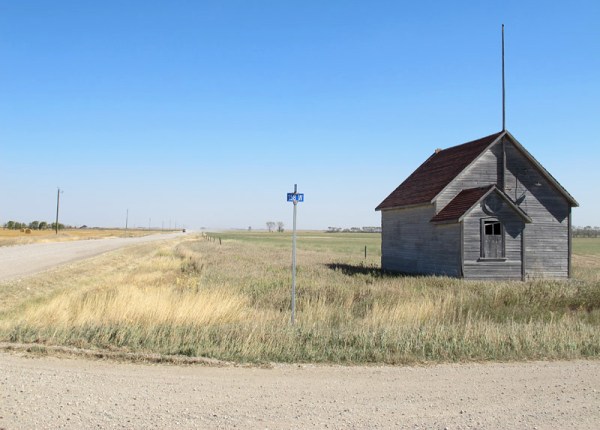 Old schoolhouse at a crossroads in southwestern Manitoba