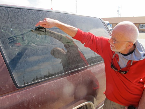 Dave Rudkin adds an endocerid cephalopod to the side of the truck.