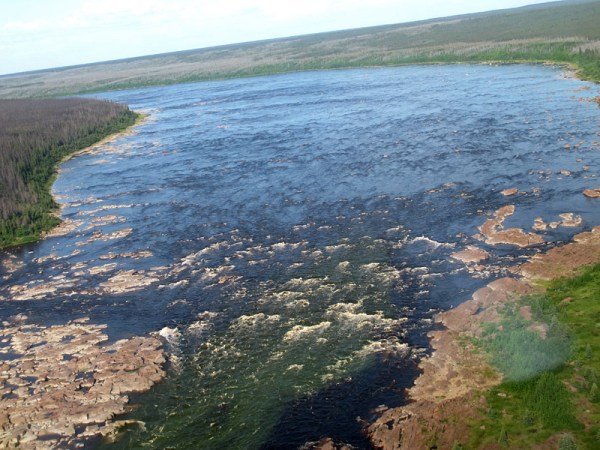 Arcuate rapids mark dangerous water at Portage Chute on the Churchill River of northern Manitoba.